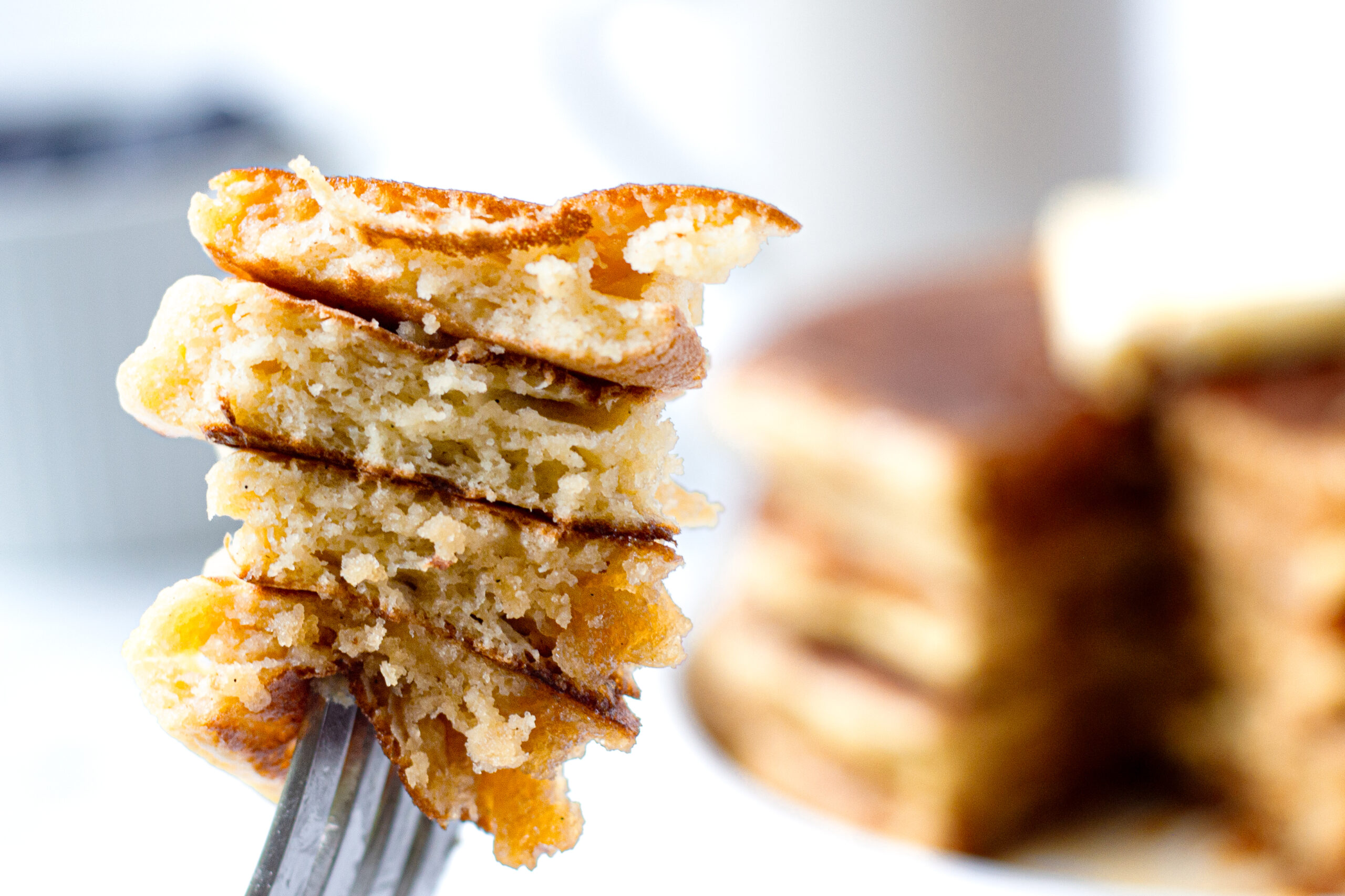 slice of stacked pancakes on a fork