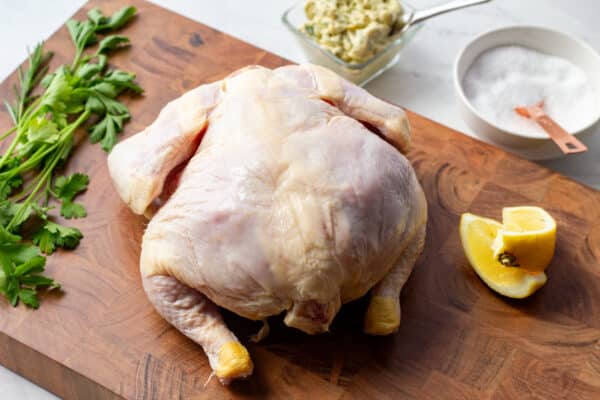 whole chicken on a chopping block
