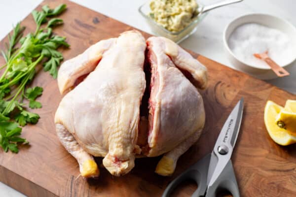 whole chicken cut on the rightside of the backbone