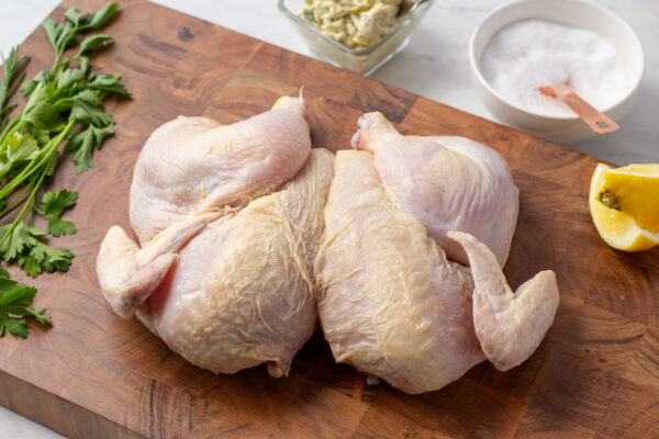 final image of what a spatchcock chicken looks like when finished butchering